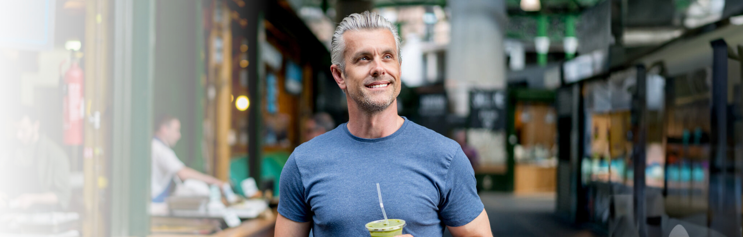 Man sitting at an outdoor cafe, illustrating testosterone health for men over 30