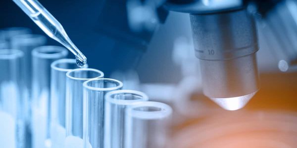 Pipette and laboratory test tubes, illustrating advanced hormone and metabolic testing